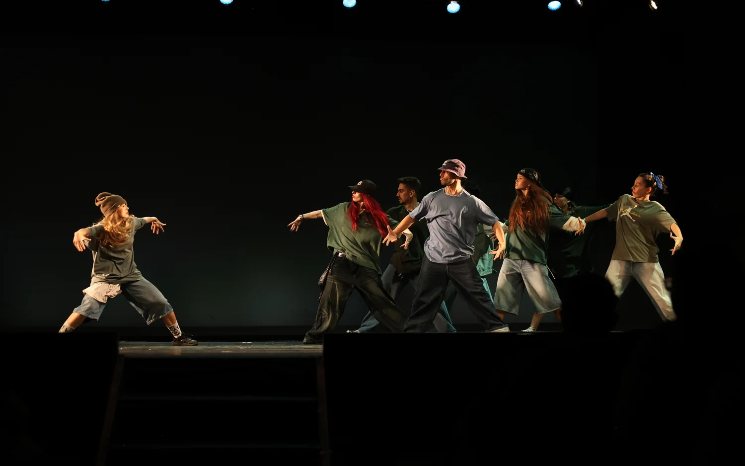 UMOVE dancers in a synchronized stage performance